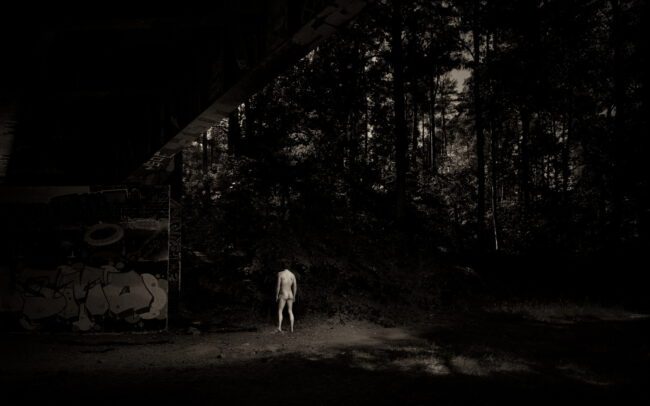 Figure in light under disused railway bridge in Berlin, former Berlin–Potsdam line, 2025. By Menno van der Meulen and Renata de Leeuw
